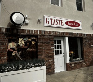 Single door, street-level entrance to G Taste